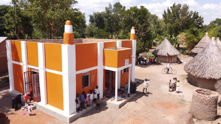 Children stood outside a newly constructed masjid in Uganda