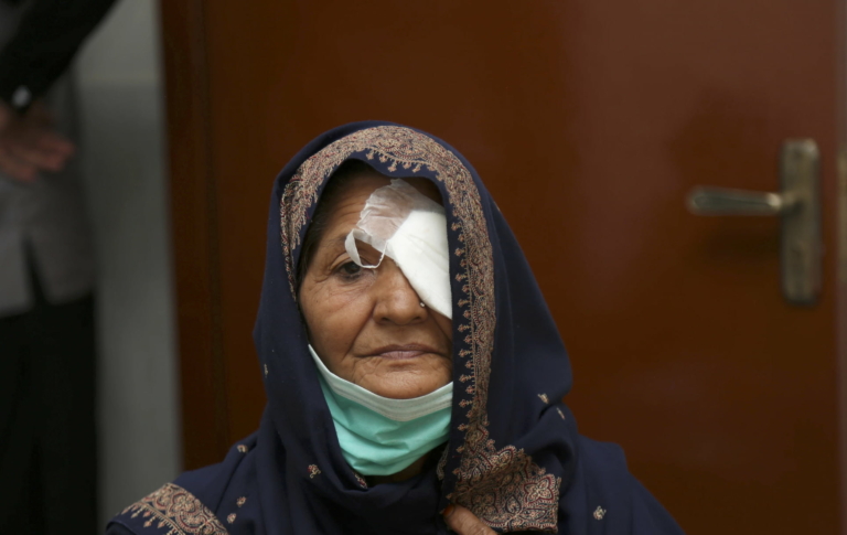 Elderly woman with a bandage over one of her eyes after a successful cataract operation