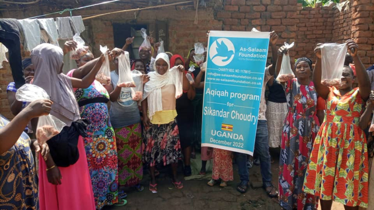 Women with bags of meat as part of an aqiqah programme in Uganda.